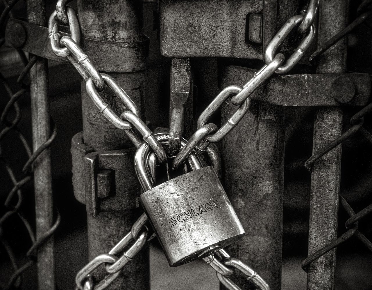 gray steel chain locked on gate